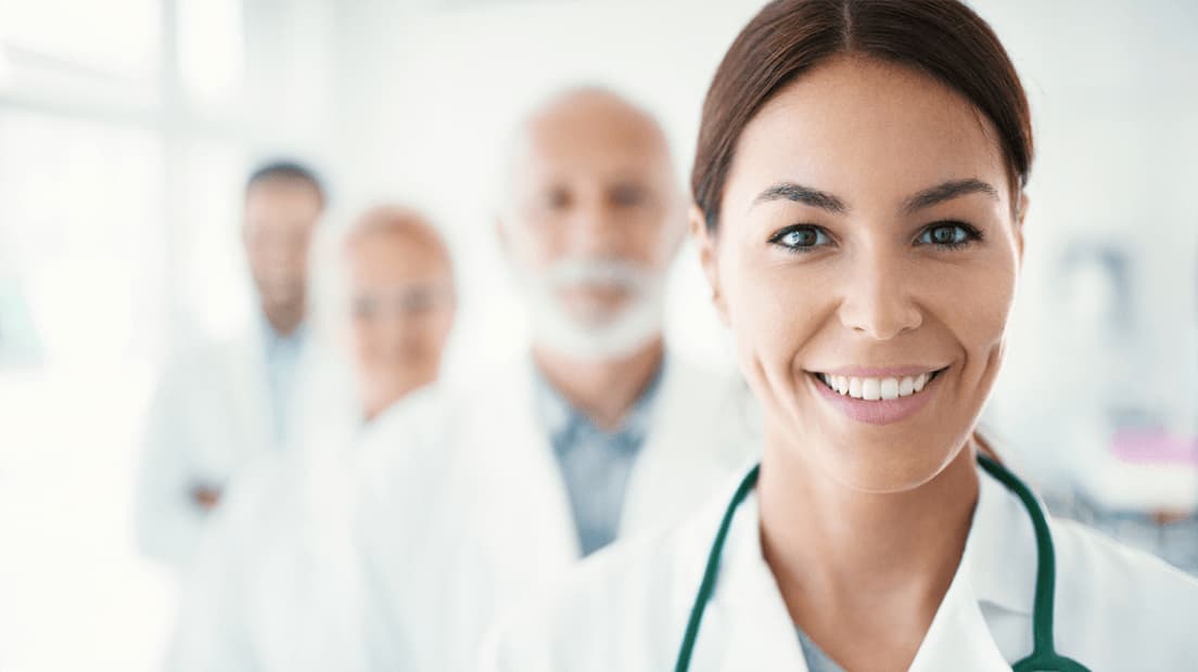 Medical professionals standing in support