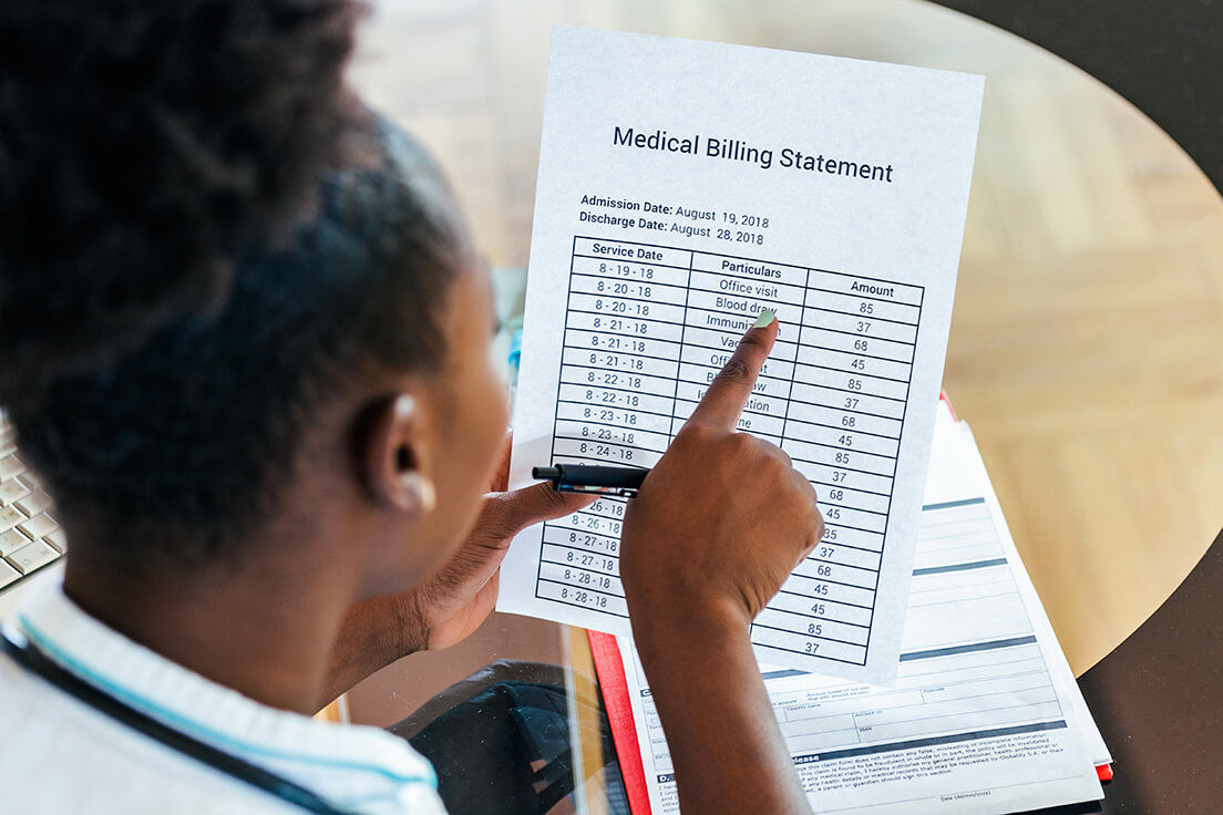 Person looking at billing statement